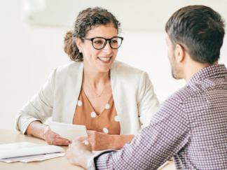 office employee discussing professional development with a colleague
